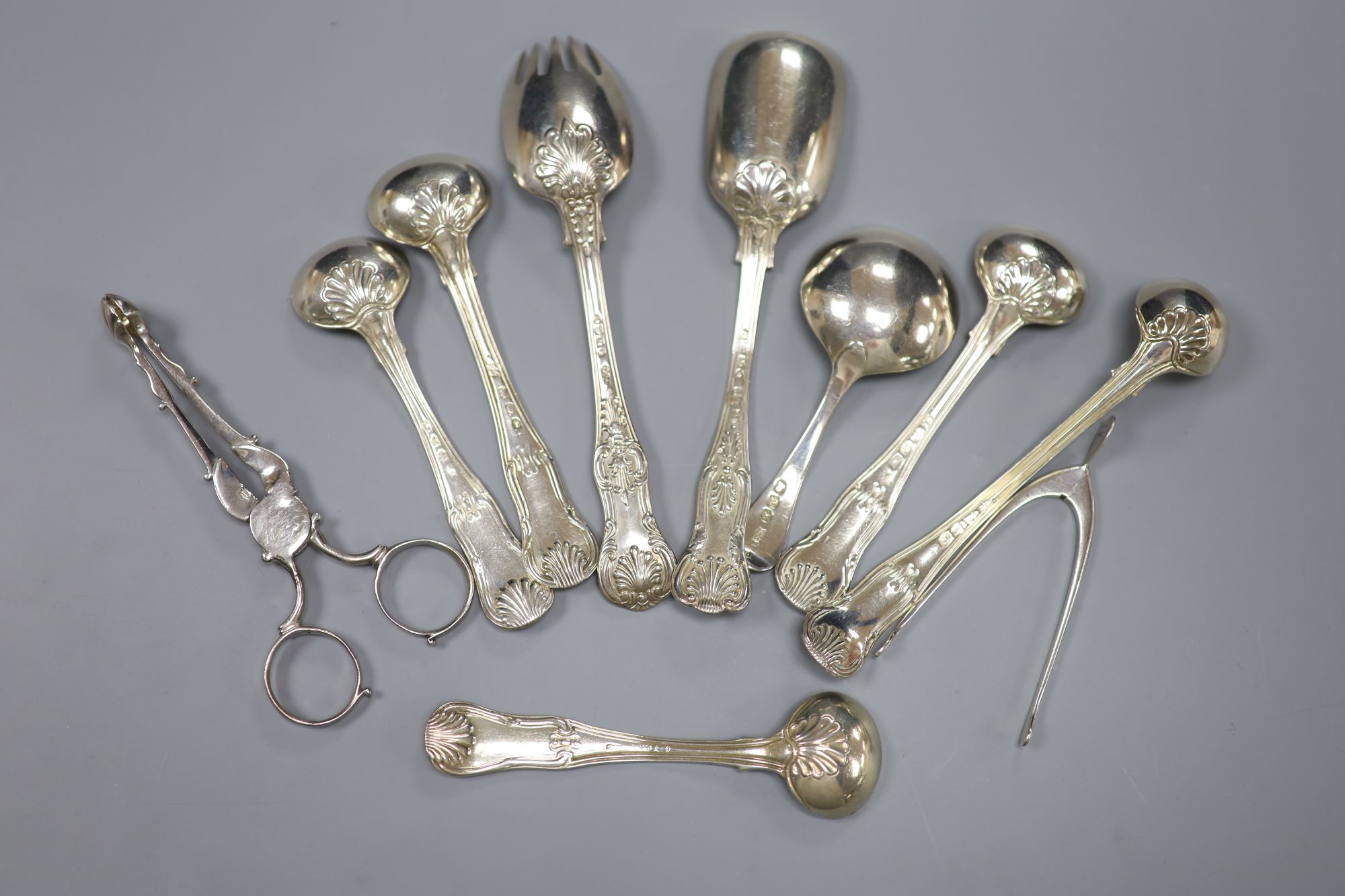 Seven various 19th century silver condiment spoons, a caddy spoon and two pairs of sugar nips including Georgian(a.f.), 8oz.